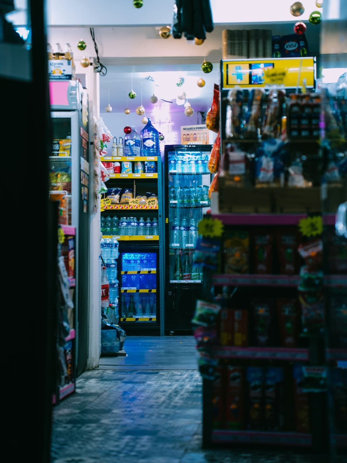 Shelves fully stocked in a busy convenience shop