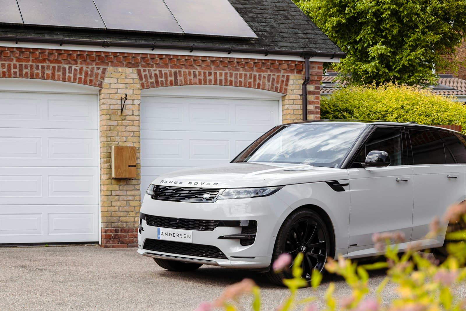 White Range Rover on a private home driveway, financed on hire purchase