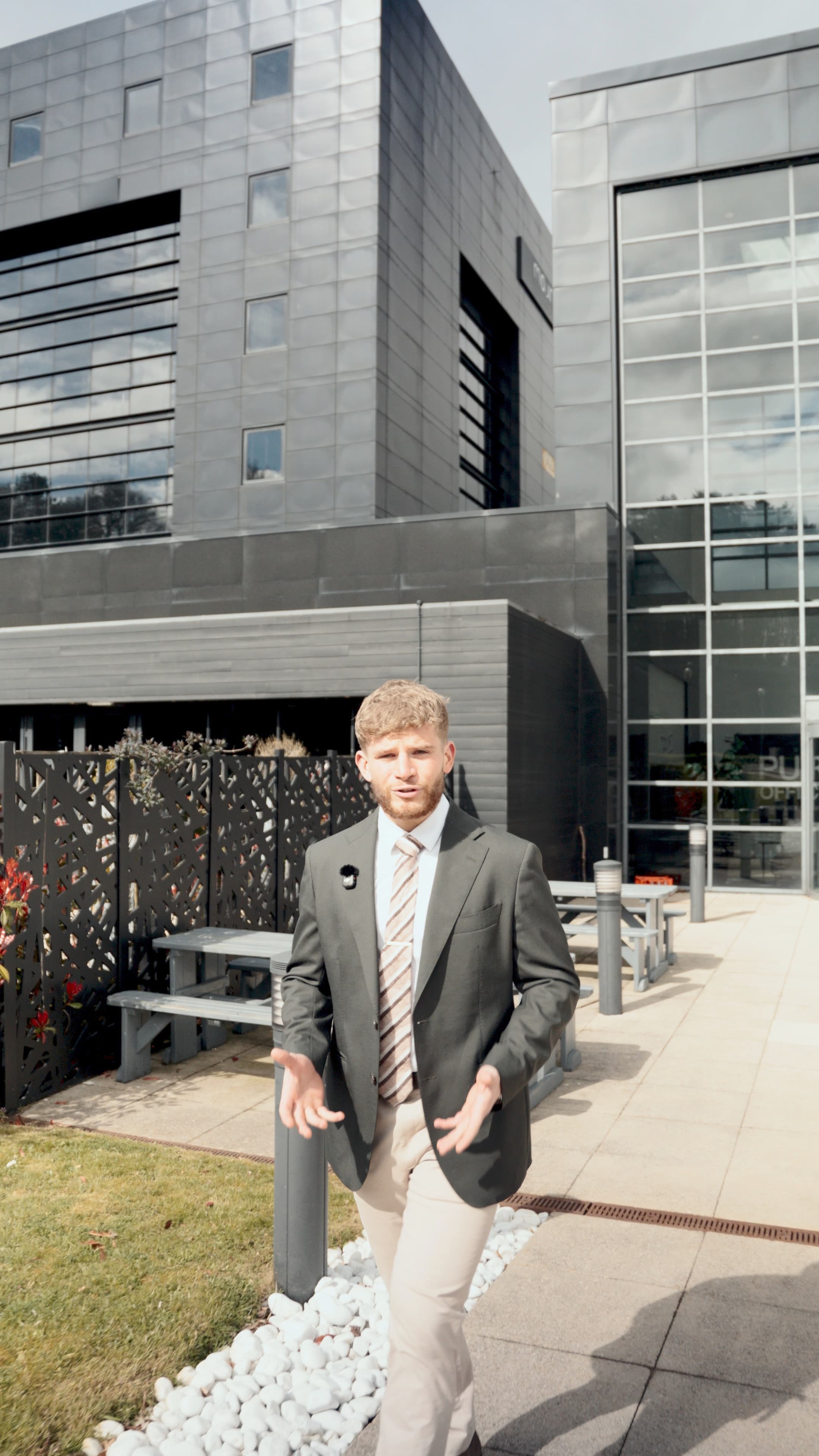 Alex walking outside the CapExpand office building