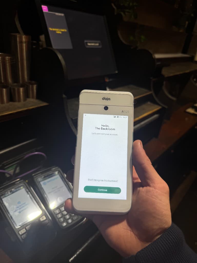 Close up of a Dojo card machine on the bar at one of our hospitality clients