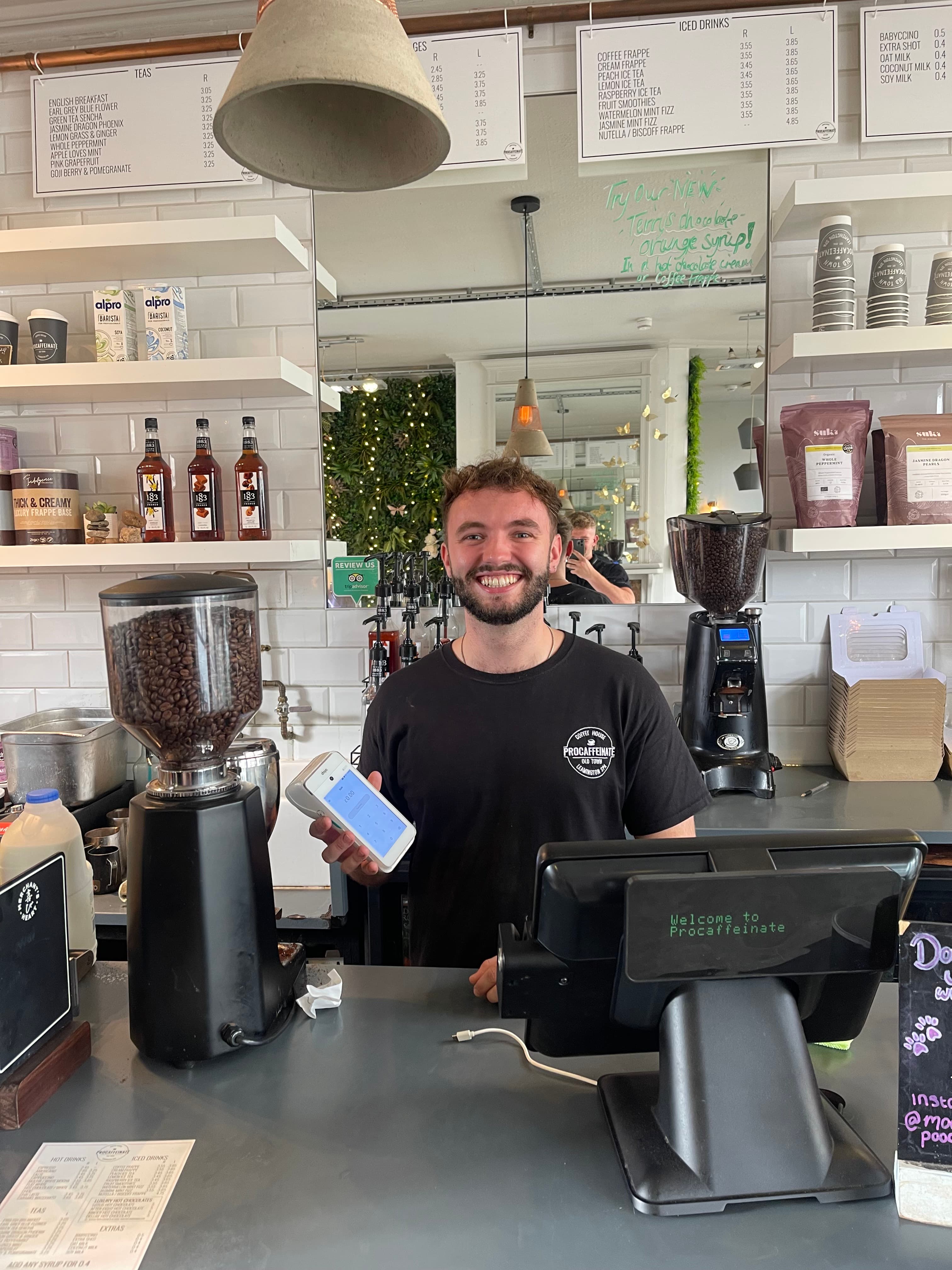 Barista preparing coffee behind the counter of an independent coffee shop