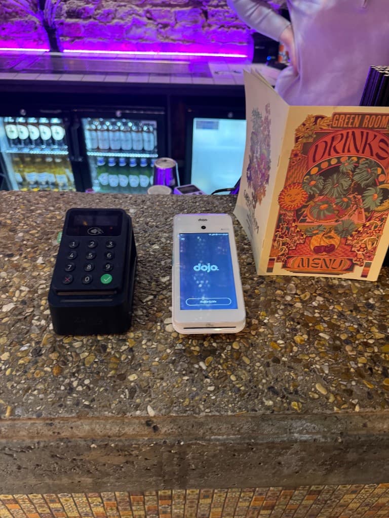Alex with a row of card terminals at one of our bar clients