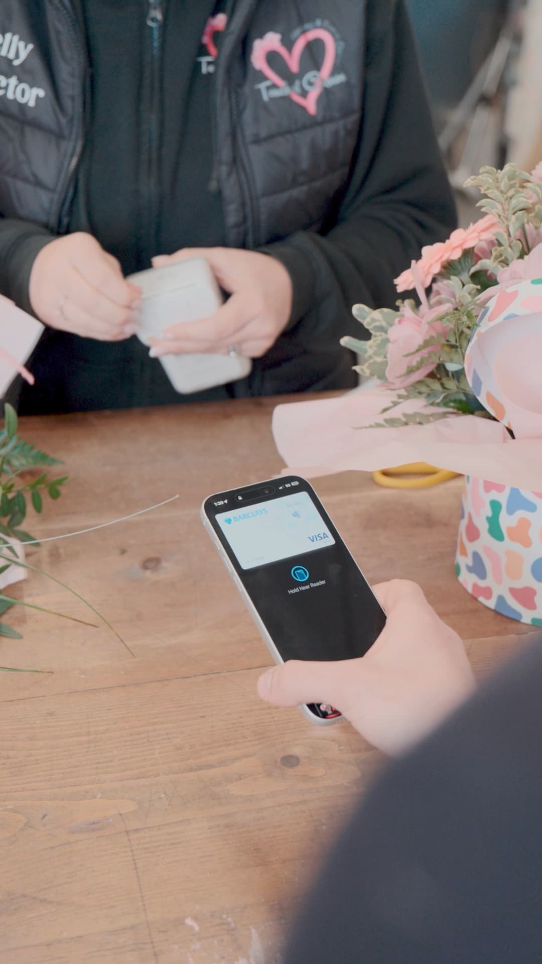 Customer making a contactless payment on a Dojo terminal at one of our retail clients